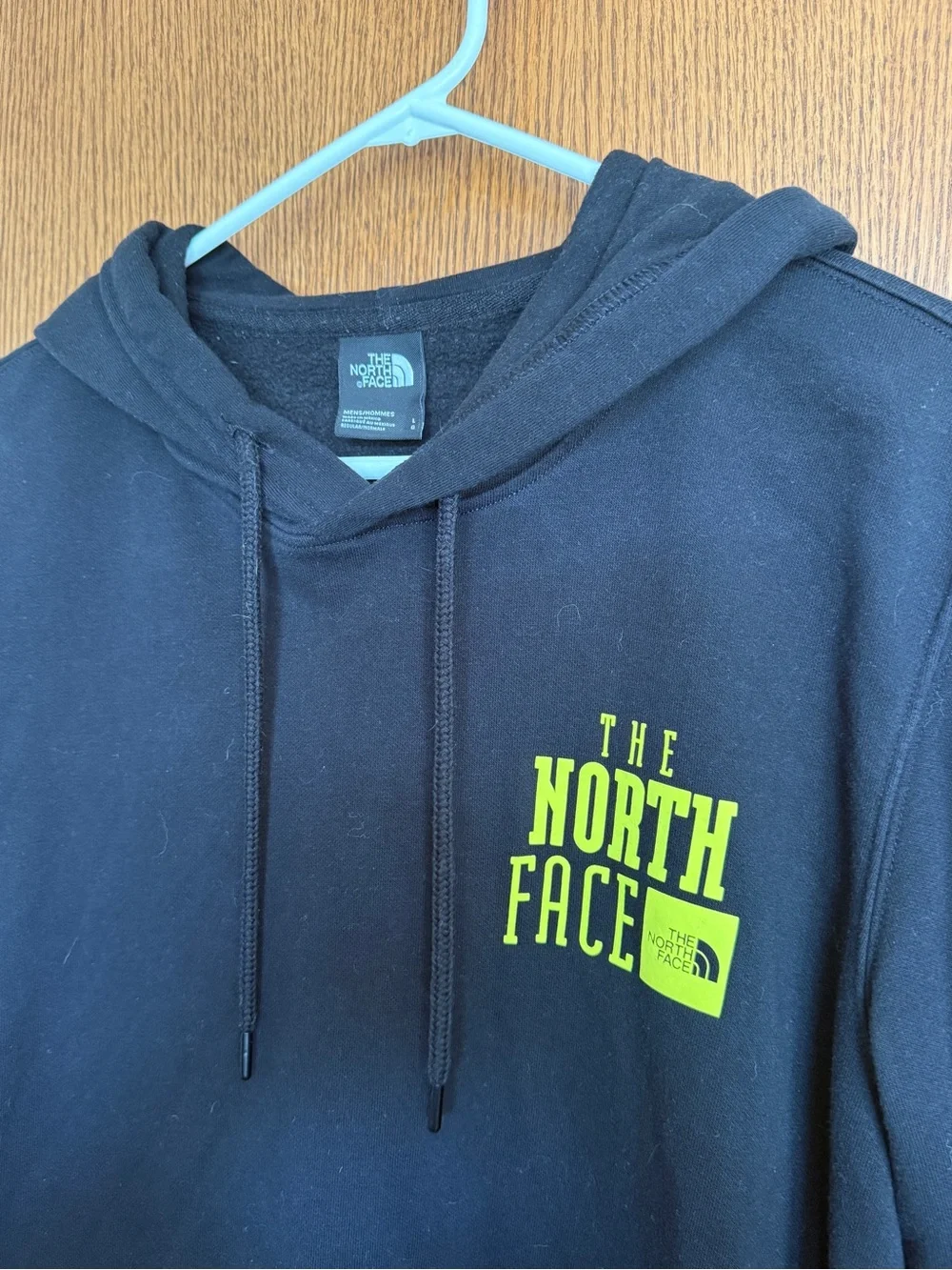 The North Face Black Hoodie with Yellow Chest Logo and Pink Sleeve Text